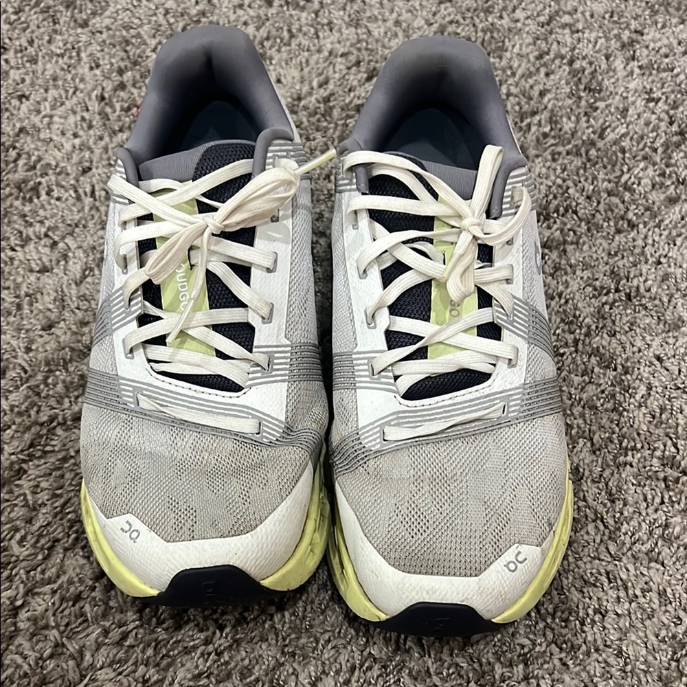 On Running White and Gray Shoes with Lime Accents
